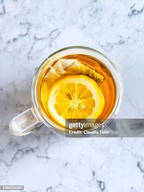 cup of tea on white background - tea cup overhead view photos et images de collection