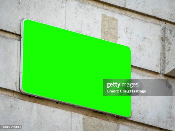 typical london city centre street sign from downing street scene - close-up - low angle view  of empty chroma key advertisement billboard commercial sign. concept for retail, economy and business growth, travel, tourism and marketing topics. - downing street sign stock pictures, royalty-free photos & images