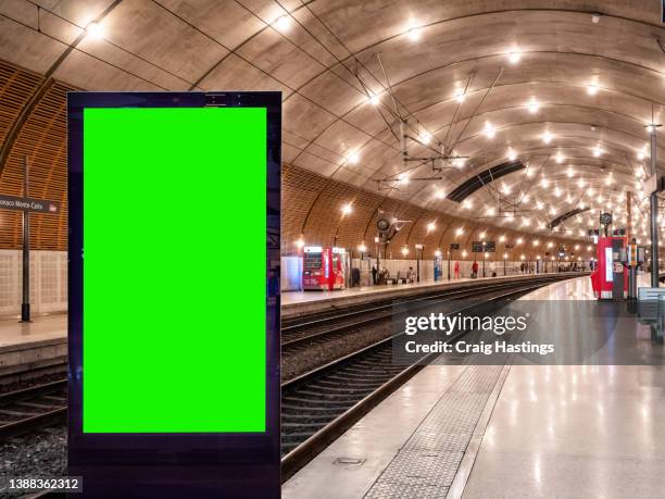 monte carlo monaco train station scene - 4k close-up - low angle view  of empty chroma key advertisement billboard commercial sign. concept for retail, economy and business growth, travel, tourism and marketing topics. - treinstation stockfoto's en -beelden