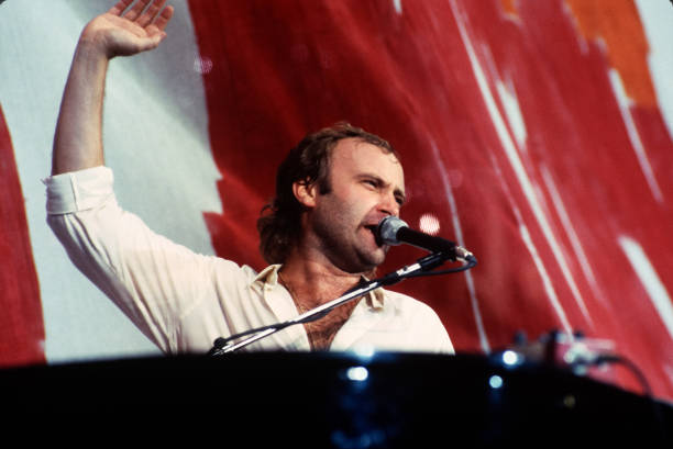 Singer Phil Collins performs during Live Aid at John F. Kennedy Stadium on July 13, 1985 in Philadelphia, PA.