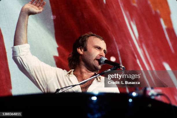 Singer Phil Collins performs during Live Aid at John F. Kennedy Stadium on July 13, 1985 in Philadelphia, PA.