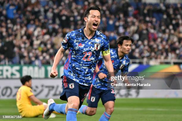 Maya Yoshida of Japan celebrates scoring his side's first goal during the FIFA World Cup Asian Qualifier Final Round Group B match between Japan and...