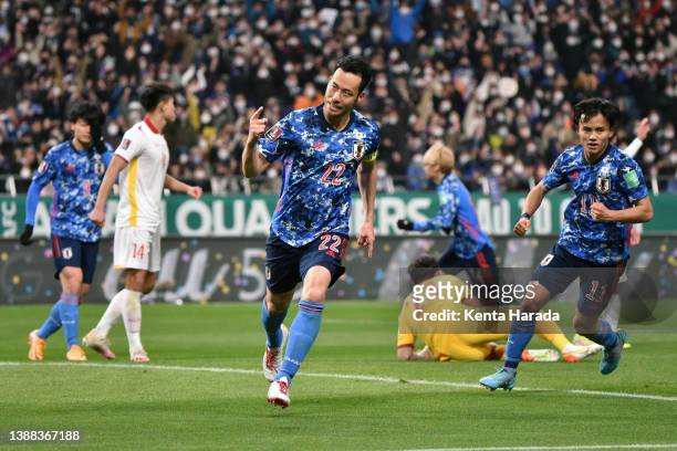 Maya Yoshida of Japan celebrates scoring his side's first goal during the FIFA World Cup Asian Qualifier Final Round Group B match between Japan and...