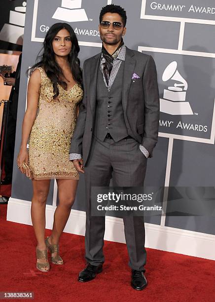 Singer Eric Benet and Manuela Testolini arrive at The 54th Annual GRAMMY Awards at Staples Center on February 12, 2012 in Los Angeles, California.