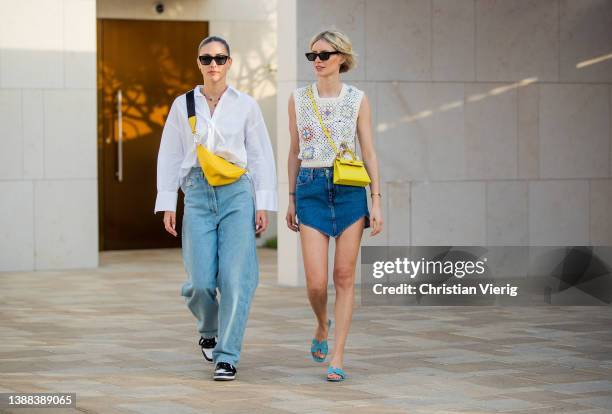 Ann-Kathrin Götze is seen wearing denim jeans & yellow bag Prada, white button shirt, sunglasses in black Chanel, black white sneakers & Lisa...