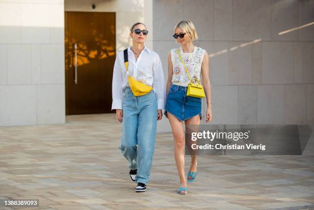 Ann-Kathrin Götze is seen wearing denim jeans & yellow bag Prada, white button shirt, sunglasses in black Chanel, black white sneakers & Lisa...