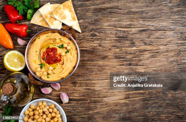 hummus with baked sweet peppers - spread over stock pictures, royalty-free photos & images