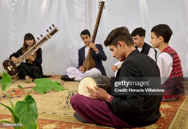 S Afghan traditional music ensemble perform at "The importance of music for the Union of peoples" event co-hosted by the Escola de Música do...