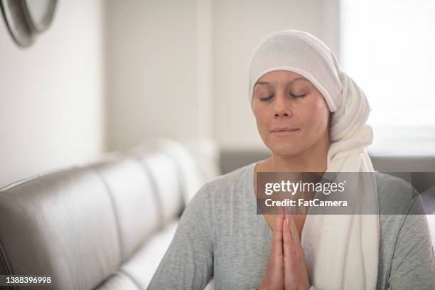 cancer patient meditating at home - nurse meditating stock pictures, royalty-free photos & images