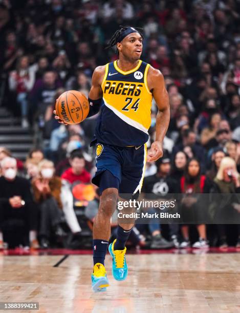 Buddy Hield of the Indiana Pacers dribbles against the Toronto Raptors during the first half of their basketball game at the Scotiabank Arena on...