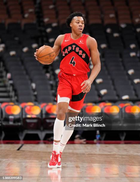 Scottie Barnes of the Toronto Raptors dribbles against the Indiana Pacers during the second half of their basketball game at the Scotiabank Arena on...