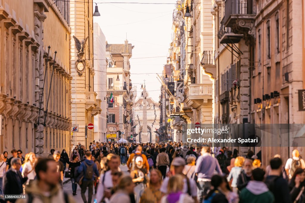 Crowds of people on Via Del Corso shopping street in Rome, Italy