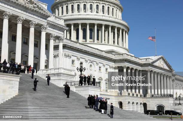 Military Honor Guard carries the casket of Rep. Don Young into the U.S. Capitol for a memorial service on March 29, 2022 in Washington, DC. Young the...
