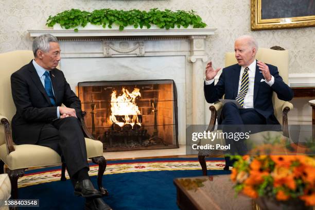 President Joe Biden speaks to reporters before a meeting with Prime Minister Lee Hsien Loong of Singapore in the Oval Office of the White House on...