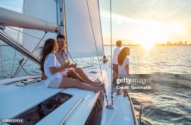 fun family vacation on luxury yacht at sunrise - lost luggage stock-fotos und bilder