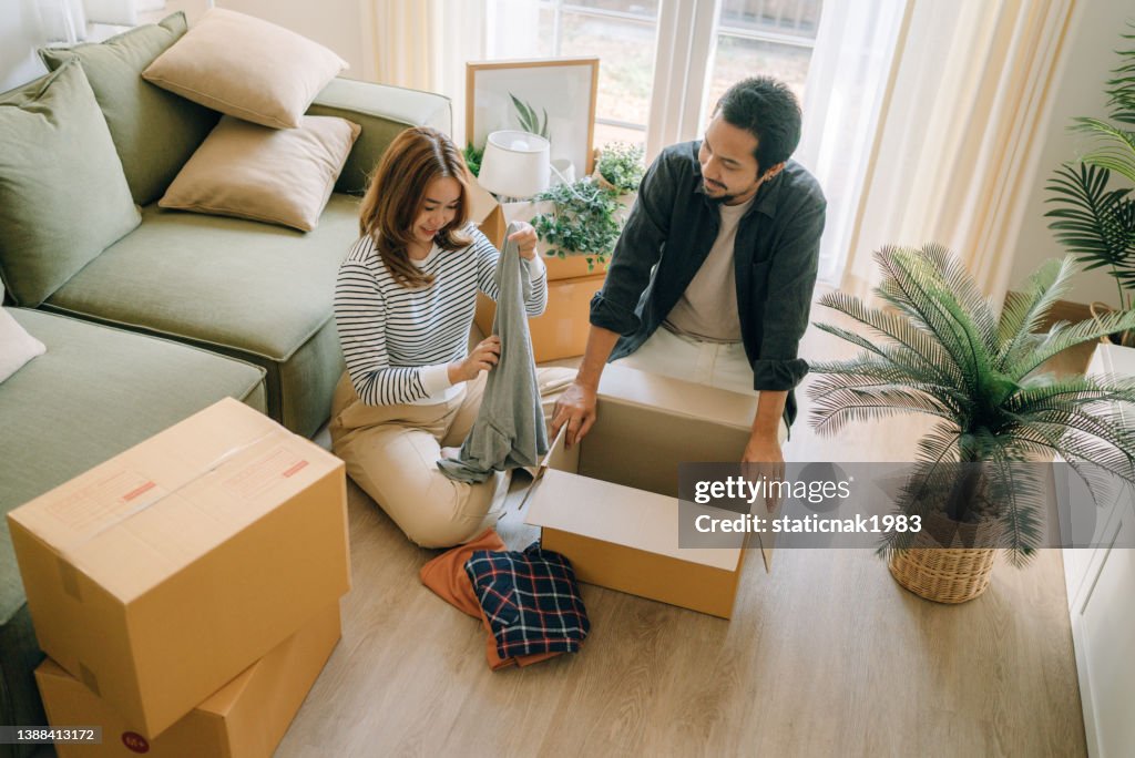 Happy couple moving new house.