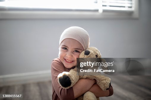 Young Cancer Patient and her Stuffed Animal Young Cancer Patient and her Stuffed Animal