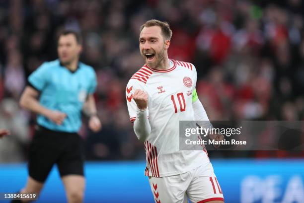 Christian Eriksen of Denmark celebrates their side's second goal scored by Jesper Lindstrom of Denmark during the international friendly match...