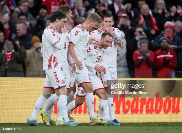 Christian Eriksen of Denmark celebrates after scoring their side's third goal with team mates during the international friendly match between Denmark...