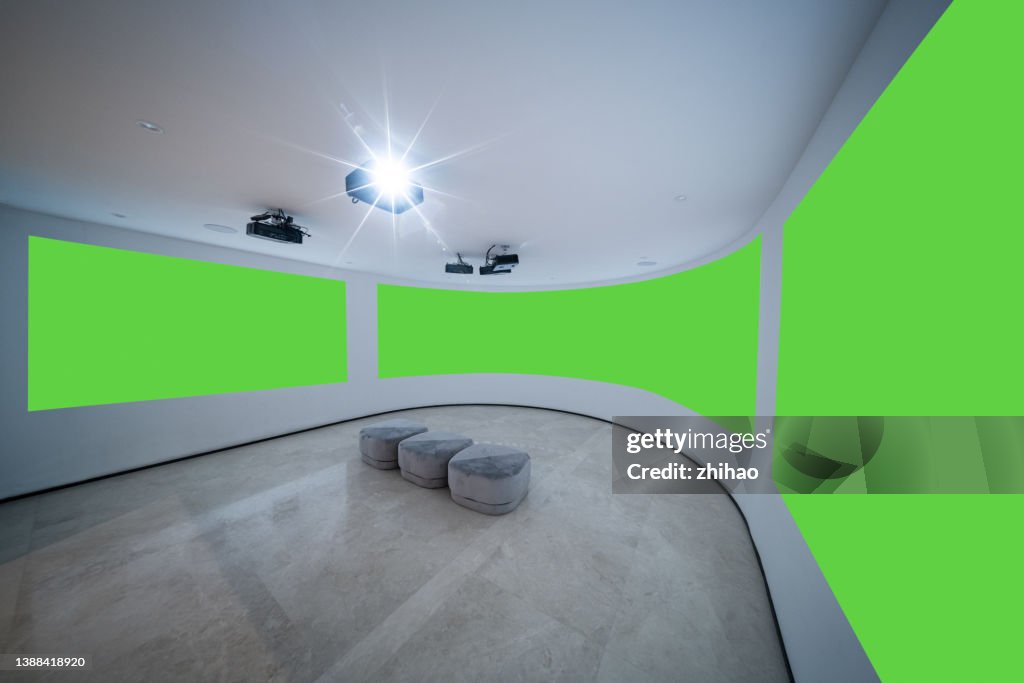 Side view of curved background wall screen in projection hall, green screen technology