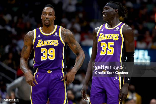 Dwight Howard of the Los Angeles Lakers and Wenyen Gabriel of the Los Angeles Lakers stand on the court during the third quarter of an NBA game...