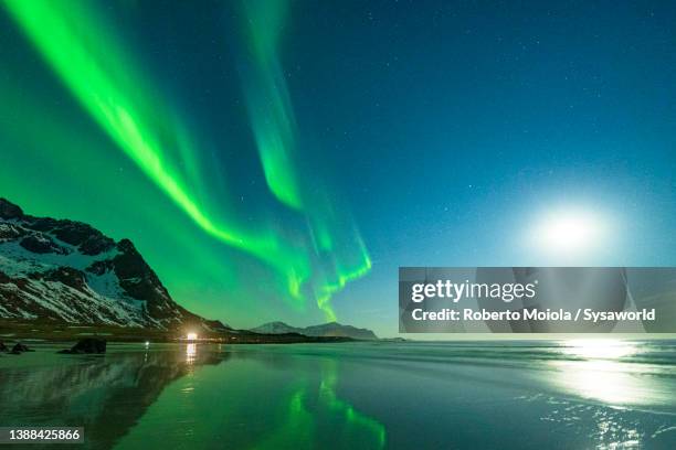 moonlight over skagsanden beach under northern lights - natural phenomena 個照片及圖片檔