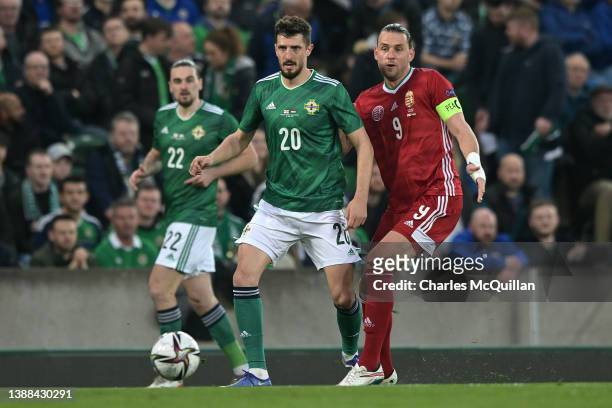 Craig Cathcart of Northern Ireland is challenged by Adam Szalai of Hungary during the international friendly match between Northern Ireland and...
