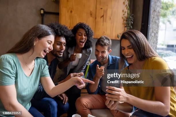 happy group of friends at a cafe and talking on a video call - group video conference stock pictures, royalty-free photos & images