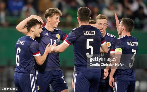 Jack Hendry of Scotland celebrates with Kieran Tierney and Grant Hanley after scoring their side's first goal during the International Friendly match...