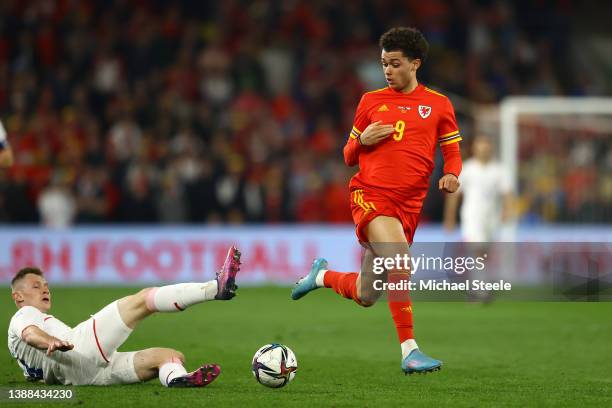 Brennan Johnson of Wales is challenged by Jakub Brabec of Czech Republic during the international friendly match between Wales and Czech Republic at...