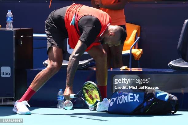 Nick Kyrgios of Australia slams his racket in his match against Jannik Sinner of Italy during the Miami Open at Hard Rock Stadium on March 29, 2022...
