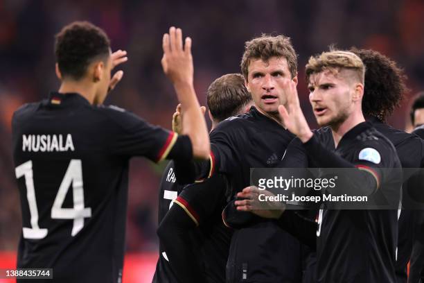 Thomas Mueller of Germany celebrates after scoring their side's first goal with Timo Werner and Jamal Musiala during the international friendly match...