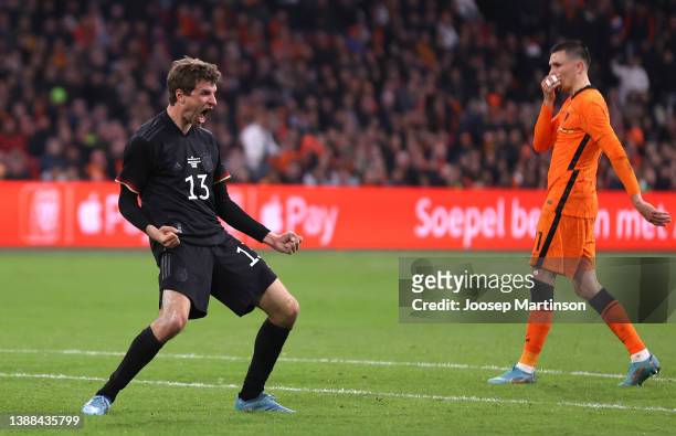 Thomas Mueller of Germany celebrates after scoring their side's first goal during the international friendly match between Netherlands and Germany at...