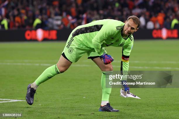 Manuel Neuer of Germany throws a paper aeroplane off the pitch during the international friendly match between Netherlands and Germany at Johan...