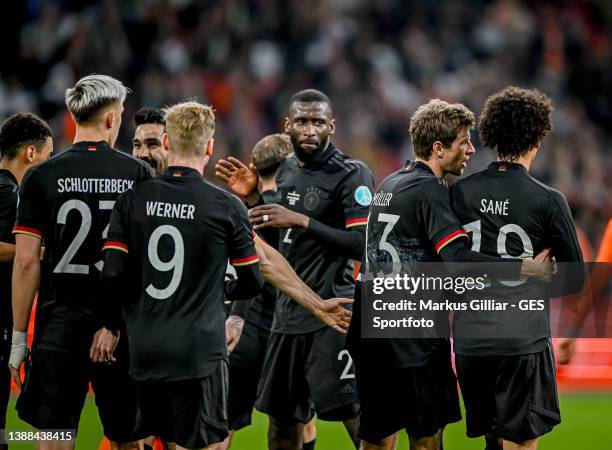 Thomas Mueller of Germany celebrates after scoring his team's first goal with Nico Schlotterbeck, Timo Werner, Antonio Ruediger and Leroy Sane during...