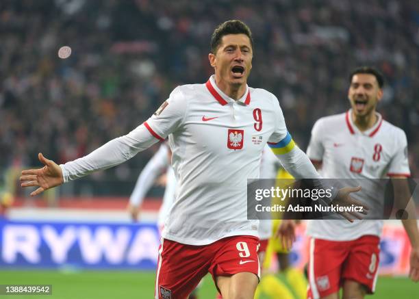 Robert Lewandowski of Poland celebrates after scoring their team's first goal from the penalty spot during the 2022 FIFA World Cup Qualifier knockout...