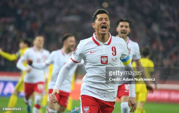 Robert Lewandowski of Poland celebrates after scoring their team's first goal from the penalty spot during the 2022 FIFA World Cup Qualifier knockout...