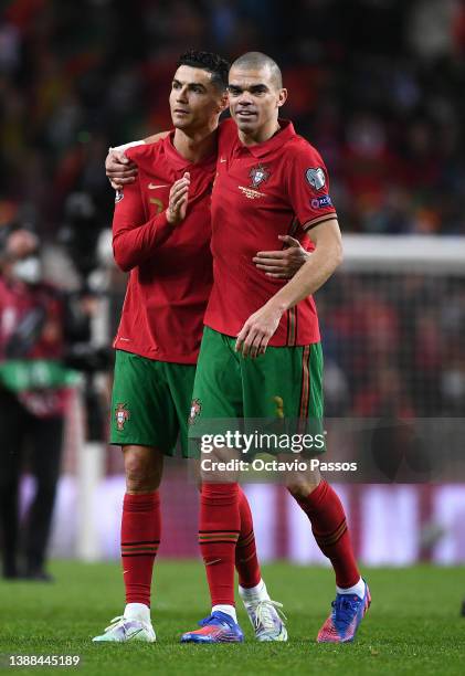 Cristiano Ronaldo celebrates with Pepe of Portugal after their sides victory during the 2022 FIFA World Cup Qualifier knockout round play-off match...