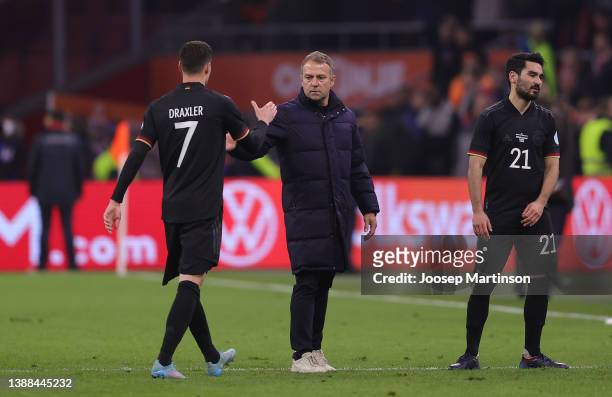 Julian Draxler of Germany shakes hands with Hans Dieter-Flick, Head Coach of Germany after the international friendly match between Netherlands and...