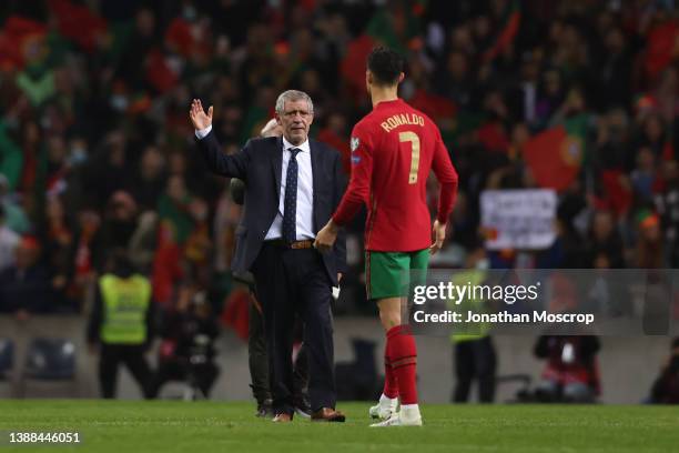 Fernando Santos manager of Portugal congratulates Cristiano Ronaldo of Portugal following the final whistle of the 2022 FIFA World Cup Qualifier...