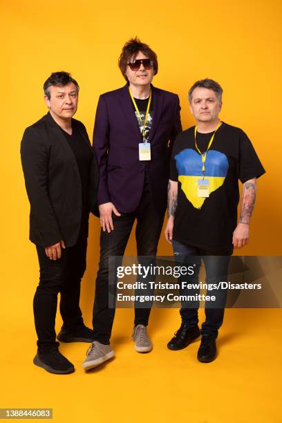 James Dean Bradfield, Nicky Wire and Sean Moore of Manic Street Preachers pose backstage during a Concert for Ukraine at Resorts World Arena on March...