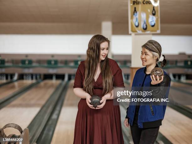 female bowling alley owners posing - bowling woman stock pictures, royalty-free photos & images