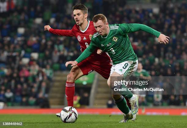 Adam Nagy of Hungary challenges Shayne Lavery of Northern Ireland during the international friendly match between Northern Ireland and Hungary at...