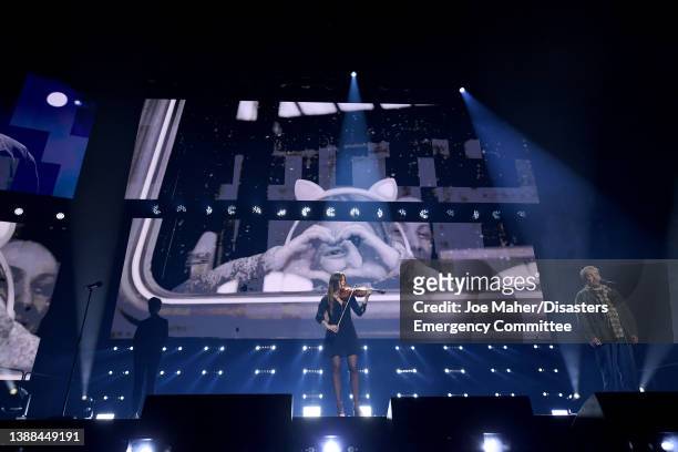 Violinist Nicola Benedetti and Eddie Marsan on stage during a Concert for Ukraine at Resorts World Arena on March 29, 2022 in Birmingham, England....