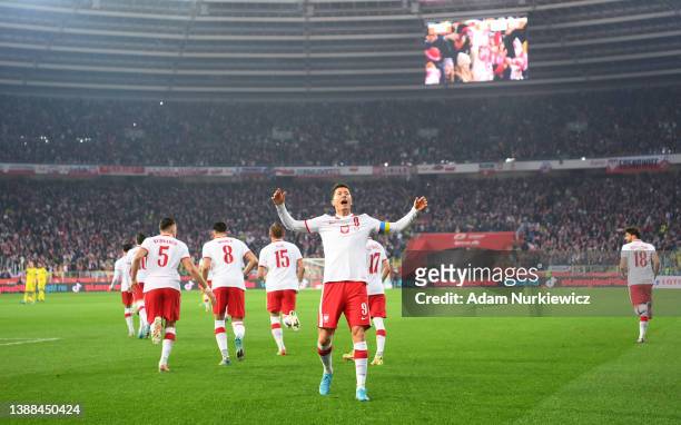 Robert Lewandowski of Poland celebrates after scoring their team's first goal from the penalty spot during the 2022 FIFA World Cup Qualifier knockout...