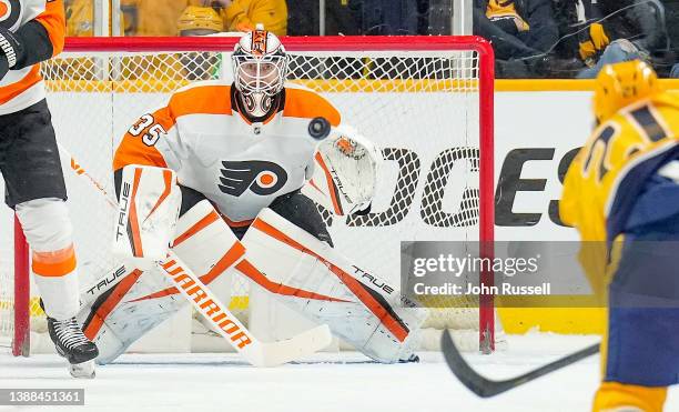 Martin Jones of the Philadelphia Flyers eyes a shot against the Nashville Predators during an NHL game at Bridgestone Arena on March 27, 2022 in...