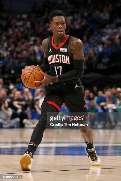 Dennis Schroder of the Houston Rockets looks to pass the ball in the game against the Dallas Mavericks at American Airlines Center on March 23, 2022...