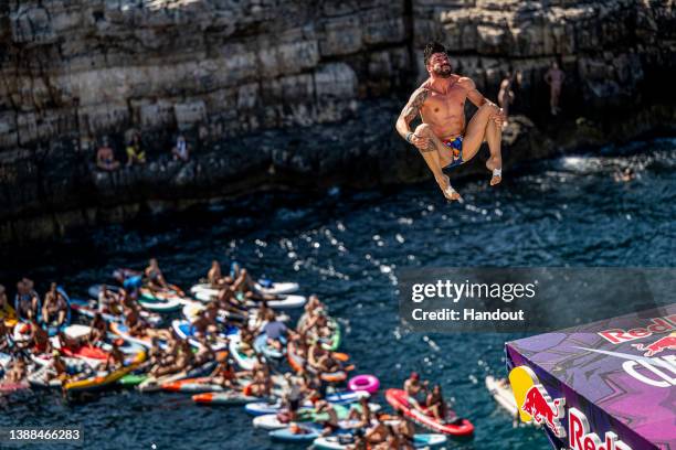 In this handout image provided by Red Bull, Carlos Gimeno of Spain dives from the 27.5 metre platform during the final competition day of the third...