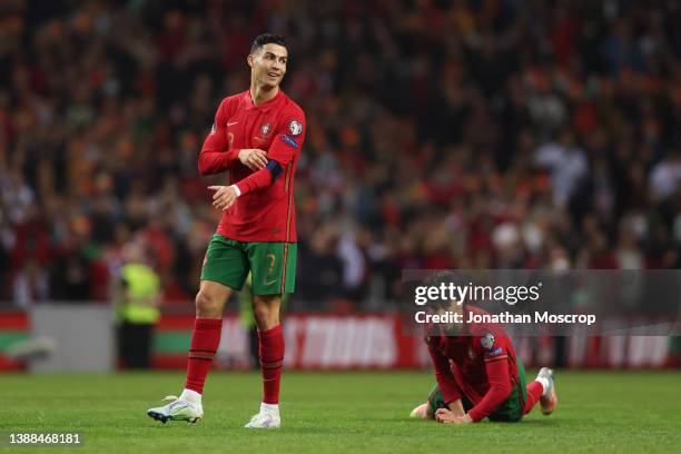 Cristiano Ronaldo of Portugal smiles ironically after the the referee Anthony Taylor of England waved away appeals for a free kick as teammate Joao...