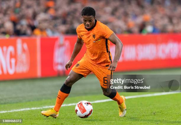 Tyrell Malacia of the Netherlands runs with the ball during the international friendly match between Netherlands and Germany at Johan Cruijff Arena...